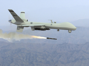 A Predator drone firing a missile.