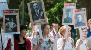 In May 2016, Russian marchers honoring family members who fought in World War II. (Photo from RT)